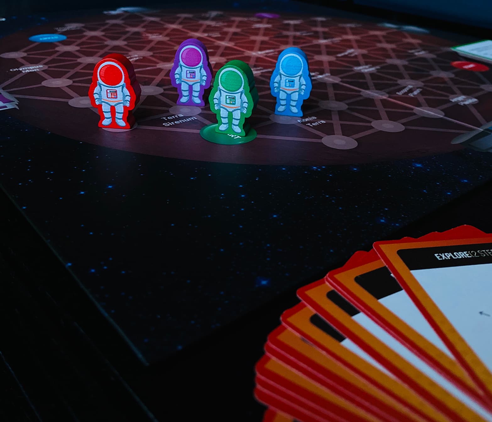 The CoderMarz board mid-game, with astronaut pieces on the Martian surface